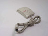 Compaq M-S28 PS/2 2-button mouse angled top view showing both buttons and coiled cable with mini-DIN connector