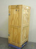 Heat treated wooden shipping crate side and front view showing butterfly latches on all panels, ISPM 15 heat treated stamp, and 4x4 raised skid base on casters