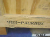 Close-up of 999-PACKBOX stencil on 4x4 skid base of heat treated wooden shipping crate