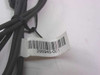 Close-up of barcode label on DC barrel extension cable clearly showing part number 295945-001