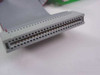Close-up of 50-pin IDC ribbon cable connector end showing dual-row pin contacts