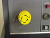 Topaz MN1C-AD075 – side panel detail showing yellow twist-lock connector (alarm/control interface) with Alarm Reset button and Silence/Enable alarm control switch
