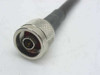Close-up of N-type male connector on ESM Cable Corp LMR-400-ULTRAFLEX coaxial cable showing center pin and knurled coupling nut