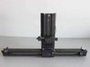 Custom optical apparatus — front view with lens housing raised and linear rail fully visible