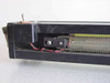 Underside view of linear rail showing chain drive, red and black wiring, and limit switch assembly