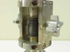 Electron gun holder feedthrough assembly vacuum chamber — close-up of threaded clamp block with coiled spring mechanism and star-knob hand adjustment hardware