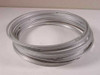 Stack of multiple 9-inch metal ring clamp flange gaskets coiled together, showing available lot quantity