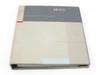 HP Hewlett-Packard service guide binder — three-quarter angled view showing binder thickness and cover wear