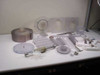 Plastic mixer parts lot — rotor bowl, round impeller disc, corrugated mixing blade assemblies, and small hardware