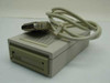 Irwin Magnetics 445 40MB External Tape Drive – three-quarter front view with interface cable draped over top