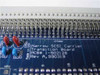 GNP PDSi Narrow SCSI Carrier Transition Board close-up of PCB label showing PCB# 1-502128 Rev A 990319 and Made in USA markings