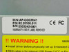 Apacer AP-COCRI41 label closeup showing model number AP-COCRI41, part number 82.20100.011, serial number 2503242-00821, CE and FCC marks