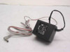 Mode Electronics DV-6500 AC adapter full view showing black transformer body and attached gray output cable with barrel plug
