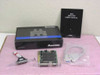 Magitronic A-B232 Mini 2S1P 8-bit ISA I/O card shown with original box, B232 Mini 2S1P User's Manual, ribbon cable, and bracket accessories laid out on a pink surface