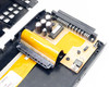 IBM 88G6400 caddy internal PCB close-up showing electrolytic capacitors, SSA connector board, and yellow flex ribbon cable
