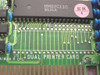 Close-up of Magitronic A-B109 PCB showing HM82C11C 9131A controller chip and QC OK sticker with DUAL PRINTER CARD silkscreen
