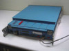 Harris TA-1023/G rear and side view showing multi-pin D-sub connectors, BNC connector, and attached cable
