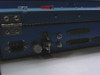 Harris TA-1023/G side panel detail showing DB9 connector, toggle switch, BNC connector, and two multi-pin D-sub connectors