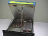 Harris TA-1023/G interior with lid open showing internal circuit board, power supply module, and internal wiring — CAUTION labels on lid