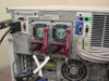 Compaq ProLiant CL1850 rear panel close-up showing dual hot-swap fan modules with red handles, Node 1 and Node 2 I/O ports, and DB9 serial connectors