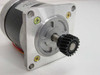 Shinano Kenshi 127K94840 stepper motor flange-end view showing gear, shaft, and four mounting holes