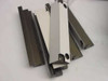 MEC Tech AMAT guide rail components — multiple anodized aluminum extrusion rails and a white bracket piece