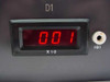Close-up of Acculex DP-304 front panel LED display showing '001 X10' reading with channel label D1 and IG1 trimmer pot