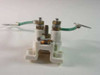 AT&T 62A/U Telephone Station Protector – side and bottom view showing DIN-style mounting base and screw terminals with grounding wire