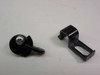 Two Abbott Spectrum incubator clamps shown close up — wheeled pivot clamp and bracket-style clamp, front view