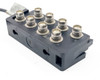 Side and bottom view of IBM 21F5093 Twinax controller block showing mounting slots and port arrangement