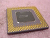Intel Pentium SX963 A80502-100 100MHz Socket 7 CPU — underside showing gold PGA pins and heat spreader markings A80502-100, SX963/SSS, lot code 253453/0CD A4