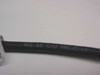 RG-58 C/U MIL-C-17 printed text on black coaxial cable jacket showing military specification marking