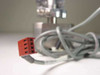 IVS Accuvision 200 — close-up of red 4-pin or 5-pin multi-conductor electrical connector on wiring harness