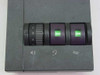 Plantronics M12 Vista amplifier top control panel close-up showing volume dial and call/mute buttons