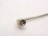 Close-up of right-angle SMA male connector on semi-rigid coax cable showing gold brass body and stainless steel pin housing