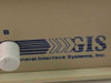 General Interface Systems Inc. GIS logo close-up on cream-colored desktop data switch enclosure