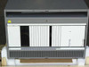 Avaya 102925 Definity ECS Carrier Cabinet – front panel open revealing card cage with 18 empty slots and backplane