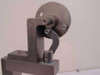 Detail of the wheel and cam actuator linkage mechanism at the top of the measurement fixture column