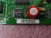 Close-up of Cisco WIC-1B-U PCB showing Lattice isp2032A 135LT44 FPGA chip and board barcode label 800-01834-03A0