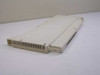 Avaya 408 GS/LS-MLX Merlin PBX module — angled top view showing beige plastic housing and ventilation slots