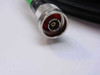 Close-up of green N-male connector on ORiNOCO 797236 low loss cable — center pin and knurled coupling nut detail
