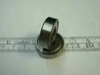 6000-2Z steel ball bearing 10x26x8mm side profile view showing shield and width alongside ruler for scale