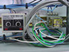 Omron S3S-B10-US Controller — close-up of first unit showing ON DELAY and OFF DELAY adjustment knobs, OPERATION and POWER indicators, DIN rail mounted