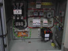 Interior view of power conditioner enclosure showing ABB EH 145 contactor, Signal Transformer MPI-650-24, ABB circuit breakers on DIN rail, and wiring