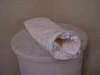 Cryo tote dewar carrier bag resting on top of a white cylindrical dewar, side profile view showing full length and fabric body