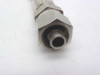 Close-up of second hex compression fitting on opposite end of orange high pressure hose — angled view