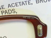 Close-up of RO 46-22 stamp on US military GI eyeglass frame showing adjustable rocking nose pad hardware