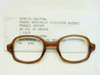 USS 6540-01-146-7796 brown cellulose acetate military spectacle front with NSN label showing 48 eye 22 bridge female specifications