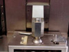 Punch tooling close-up – hexagonal stainless steel punch tip on work platen with fixture and alignment bracket