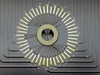 Closeup of C48-1VHT radial cantilever probe array showing individually labeled probe fingers arranged in a full circle around the center contact